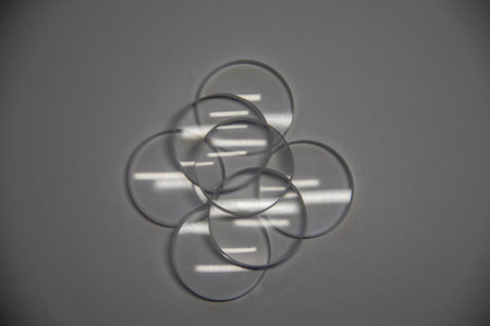 optical glasses as magnifying glasses in a heap show light reflections
