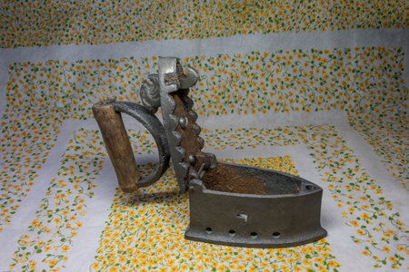 old antique iron iron with coal compartmentの写真素材