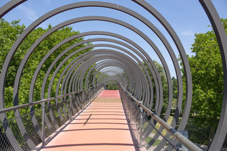 Pedestrian bridge over the river in the city park, close-upの写真素材