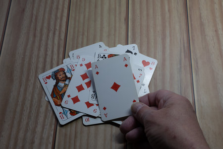 A card game playing cards lies on table close up