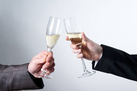 Making a toast with champagne glassの写真素材