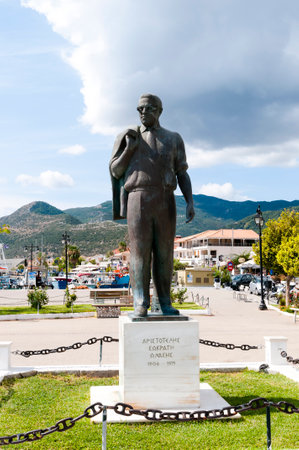 Nydri, Lefkada island, Greece- September .09.2021: the bronze statue of Aristotle Onassis in the sea front, possibly the most famous Greek tycoon who owned Scorpiosのeditorial素材