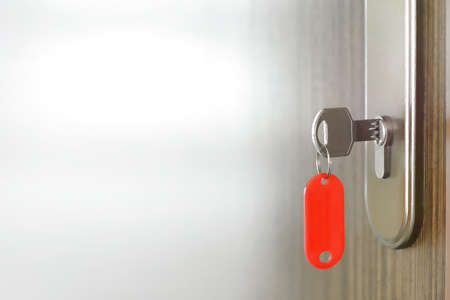 House key in door copyspace