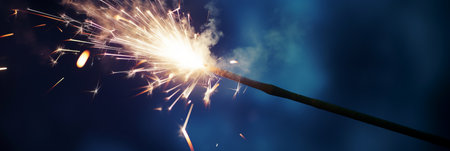 Holding a sparkler for independence dayの素材