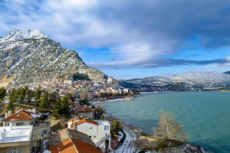 Turkey, Isparta province, beautiful Egirdir lake and Needle mountain with mosque in winter