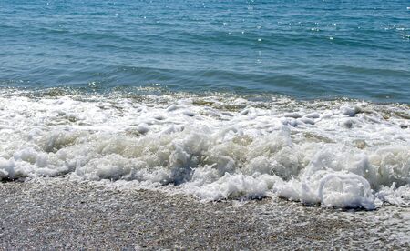 Sea wave and foam, relaxation nature backgroundの写真素材