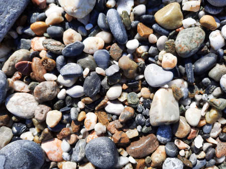 Sea stones, small colorful pebbles background, close-up view