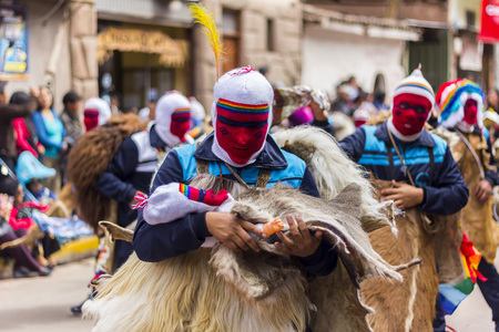 Pisac, Peru - July 16, 2013  masked dancers at Virgen del Carmen paradeのeditorial素材