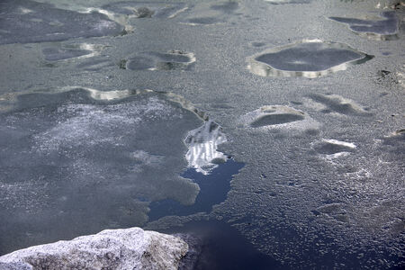 ice melting in the Llaca lagoon on the peruvian Andes at Huaraz Peruの写真素材