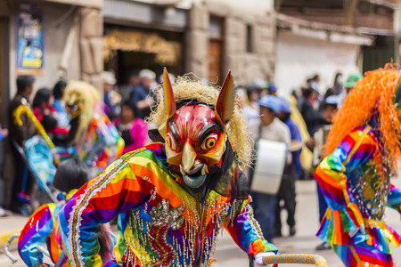 Pisac, Peru - July 16, 2013  masked dancers at Virgen del Carmen paradeのeditorial素材
