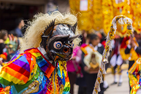 Pisac, Peru - July 16, 2013  masked dancers at Virgen del Carmen paradeのeditorial素材