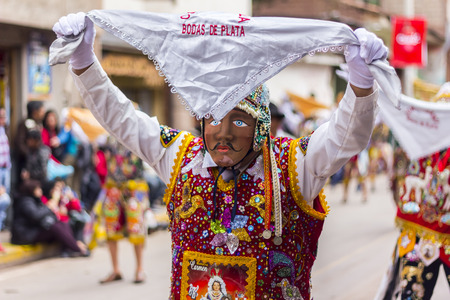 Pisac, Peru - July 16, 2013: masked dancers at Virgen del Carmen paradeのeditorial素材