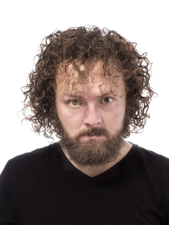 one bearded mad man furious portrait on white backgroundの写真素材