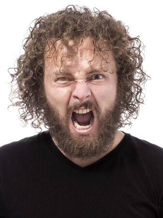 one bearded man portrait screaming on white backgroundの写真素材