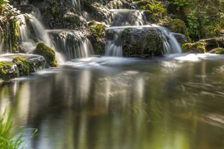 waterfall long exposure at the Vincennes forest in Parisの写真素材
