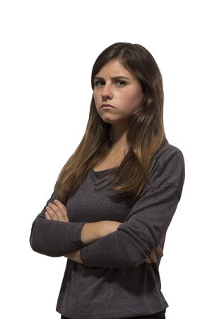 one beautiful teenage girl angry portrait in white backgroundの写真素材