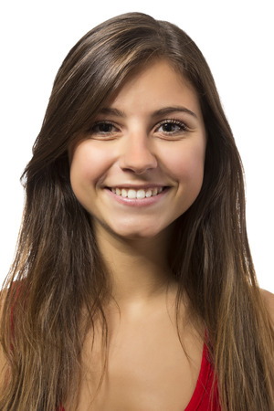 one beautiful teenage girl smiling portrait in white backgroundの写真素材