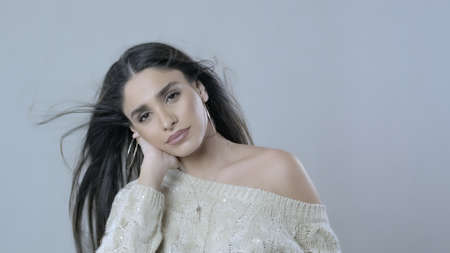 Beautiful Woman With Long Curly black Hair.Fashion Model Looks To The Cameraの写真素材