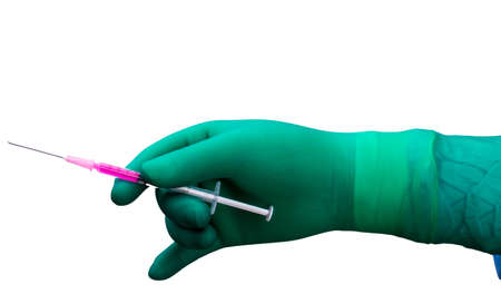 a human hand in gloves and a injection