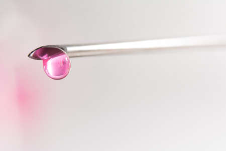 a medical injection with needle and medicine dropの写真素材