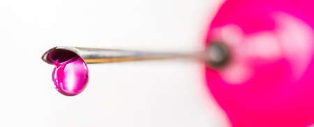 a medical injection with needle and medicine dropの写真素材