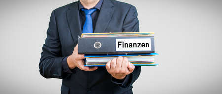 a businessman with folders and documents on his handsの写真素材