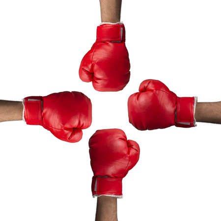 Four boxing gloves against white backgroundの写真素材