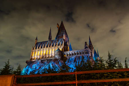 OSAKA, JAPAN - AUGUST 12, 2018: Night view of Hogwarts Castle. The Wizarding World of Harry Potter in Universal Studios Japan. Universal Studios Japan is a fun and famous theme park in Japan.のeditorial素材