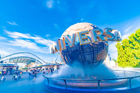 OSAKA, JAPAN - August 12, 2018. Tourists and theme park visitors front of rotating globe fountain in front of Universal Studios. Universal Studios Japan is a fun and famous theme park in Osaka, Japan.のeditorial素材