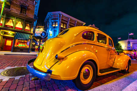 OSAKA, JAPAN - AUGUST 10, 2019: Night view of Yellow cab at NEW YORK AREA in Universal Studios Japan. Universal Studios Japan is a fun and fame park in Japan.のeditorial素材