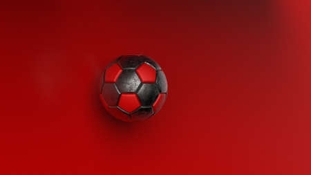 Rusty metallic silver-red soccer ball on red dots wall under spot light. 3D illustration. 3D high quality rendering.の写真素材