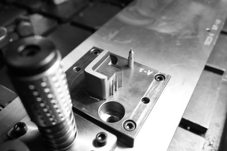 Iron wire rope placed on striped steel plate. Black and white photo. Conceptual images of blockchain, human connection and solid fixation.の写真素材