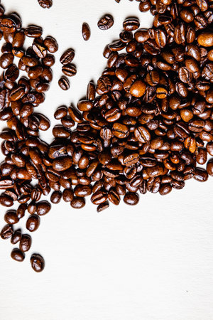 Roasted coffee beans on white leather sheet.の写真素材