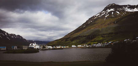 Icelandic landscape view of a small city called SeyÃ°isfjÃ¶rÃ°ur.の写真素材