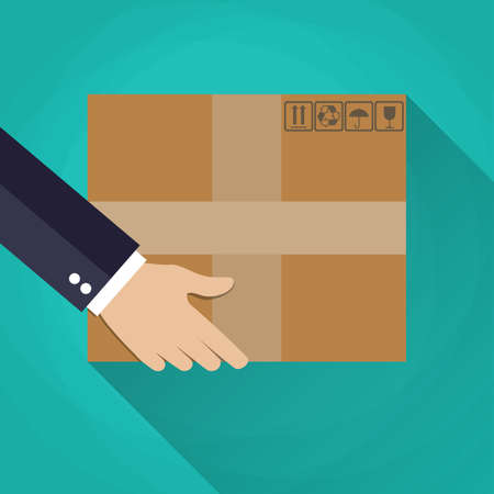 businessman Hand carrying a cardboard box. delivery concept. vector illustration in flat design on green background with long shadowのイラスト素材