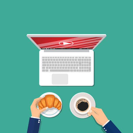 Man with a cup of coffee and a croissant watching a video on a laptop. Video streaming concept. Vector illustration in flat styleのイラスト素材