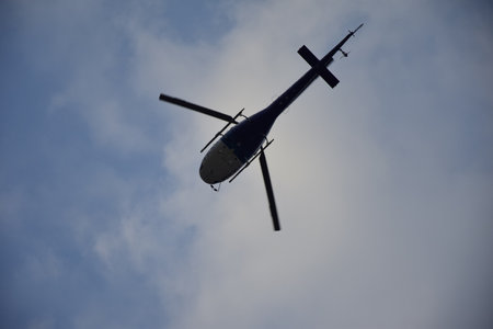 Helicopter flying against the blue sky. Guayaquil, Ecuadorの写真素材