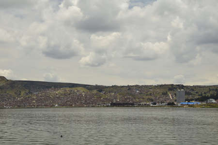 The coast of Lake Titicaca overlooking the city of Puno, Peru.
