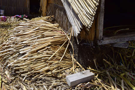 Floating islands near Puno city, Buildings and houses made of straw on the floating islands of Lake...