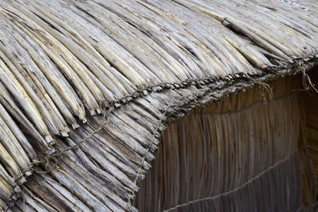 Floating islands near Puno city, Buildings and houses made of straw on the floating islands of Lake...