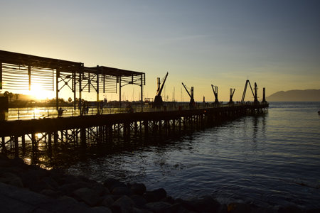 City pier with wooden flooring on the harbor of Antofagasta, Chile