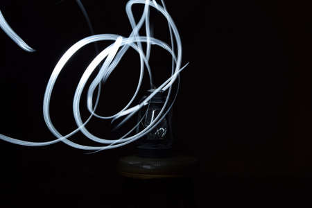 Drawing with light on a photo in the studio.の写真素材