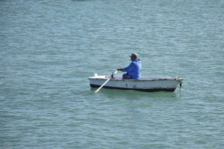Cadiz, Spain - 06 november 2019: Fisherman on a boat.のeditorial素材