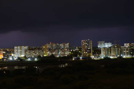 Lightning thunderstorm flash over the night city. Concept on topic weather, cataclysms.の写真素材