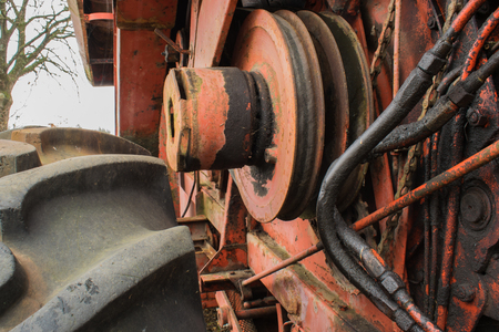 Wheel and inside of red farming machineryの写真素材