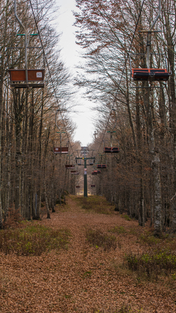 Chair lift on a mountain in autumnの写真素材