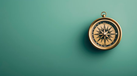 Vintage compass on green background with copy space. Top view.の素材