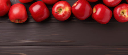 Red apples on wooden background. Top view with copy space for your textの素材