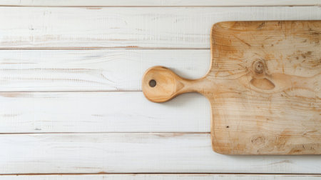 A wooden cutting board featuring a sturdy wooden handle for easy gripping. The board is ideal for chopping vegetables, fruits, and meats in the kitchen.の素材