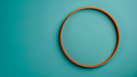 An orange circle stands out against a vibrant blue background. The contrast between the colors creates a striking visual impact. The simple yet bold design is visually appealing and eye-catching.の素材